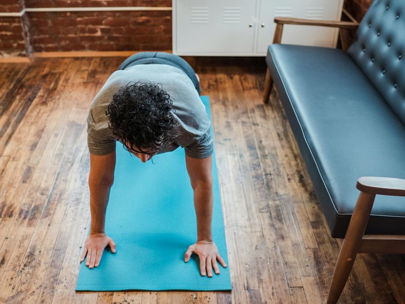 High quality yoga mat on a light wooden floor.